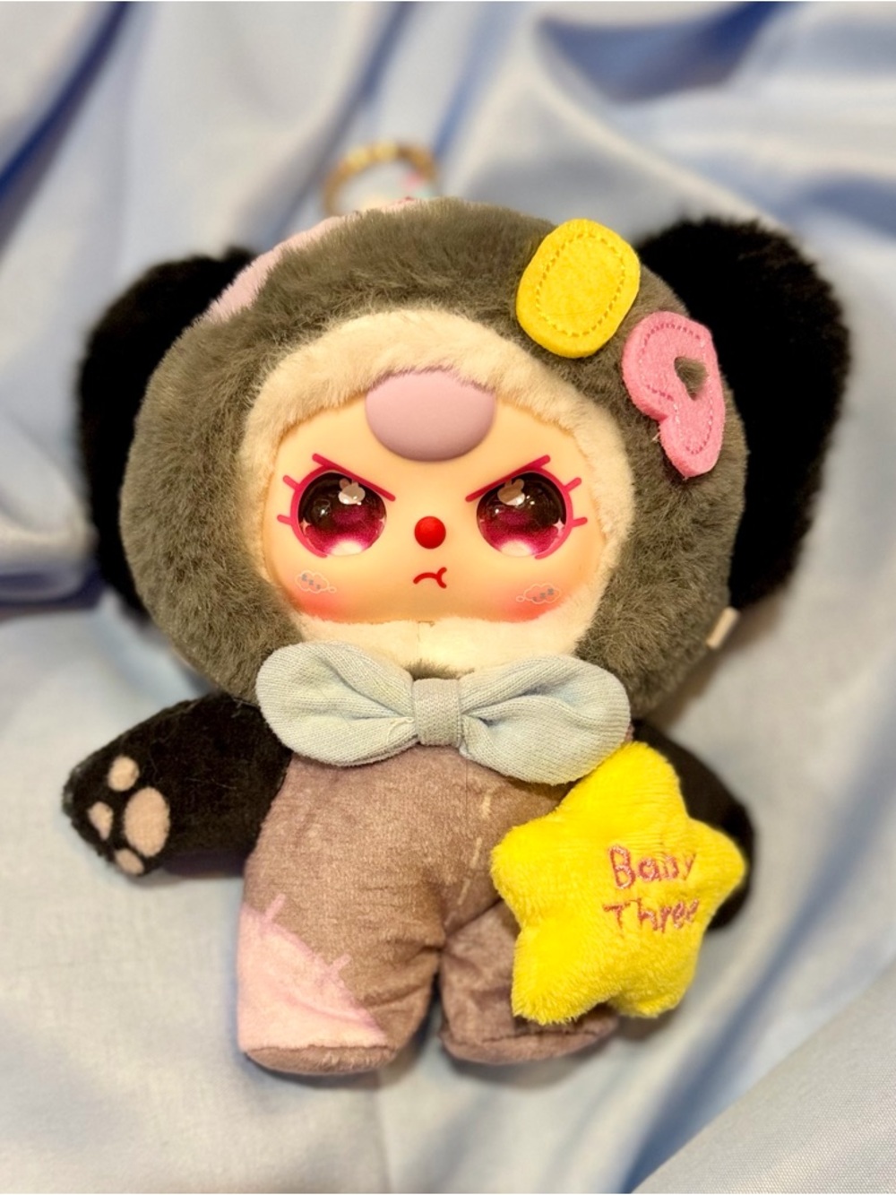 Plush Doll Keychain with Pink-Eyed Face and Yellow Star